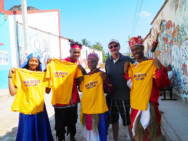 Cubans holding Sun Devil merchandise